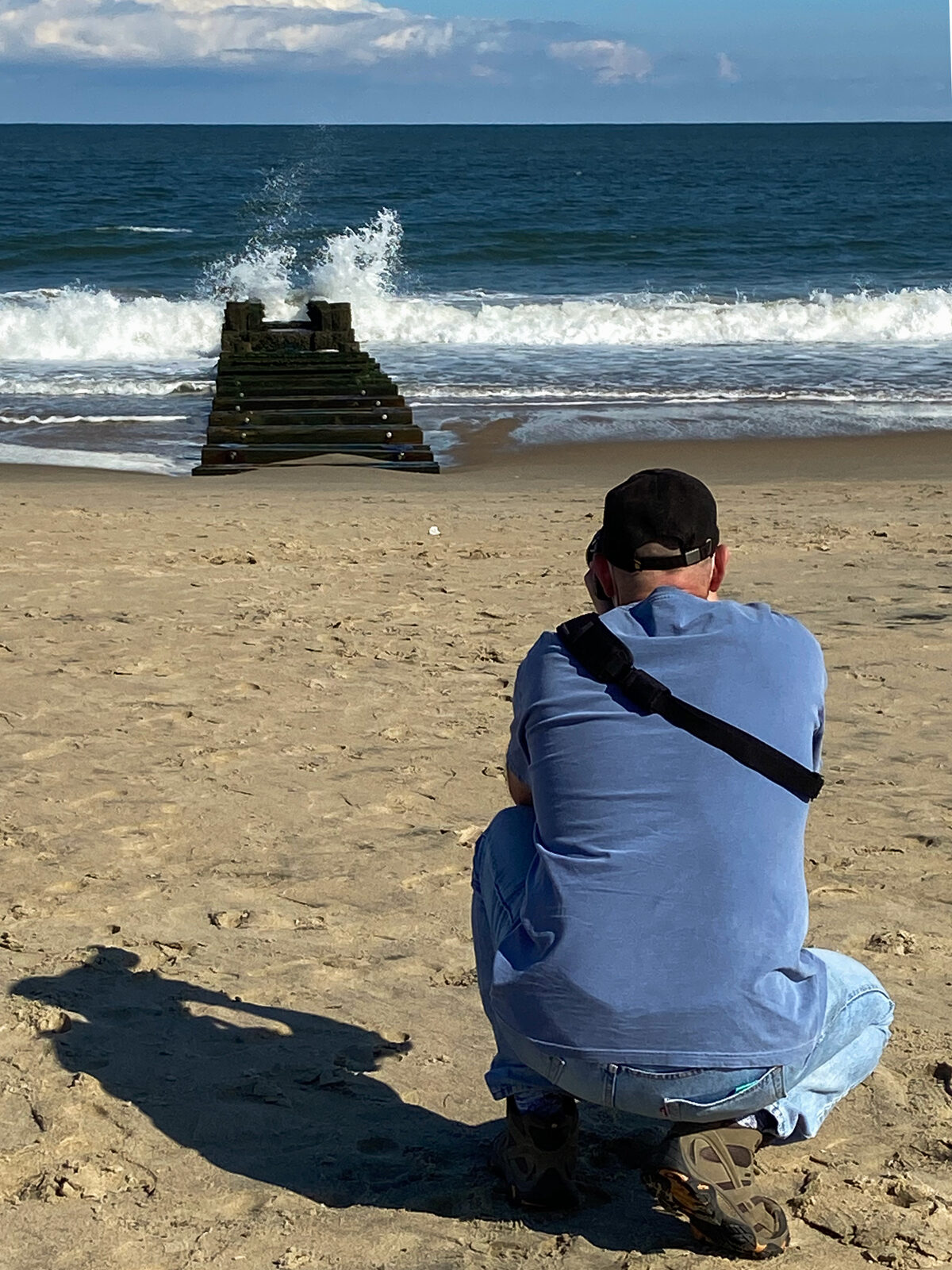 Brad Balfour photographing waves rolling onto the beach
